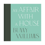The cover of "An Affair with a House" by Abrams displays a light green background with elegant white and dark green text, capturing the timeless spirit of interior design featured in the book.