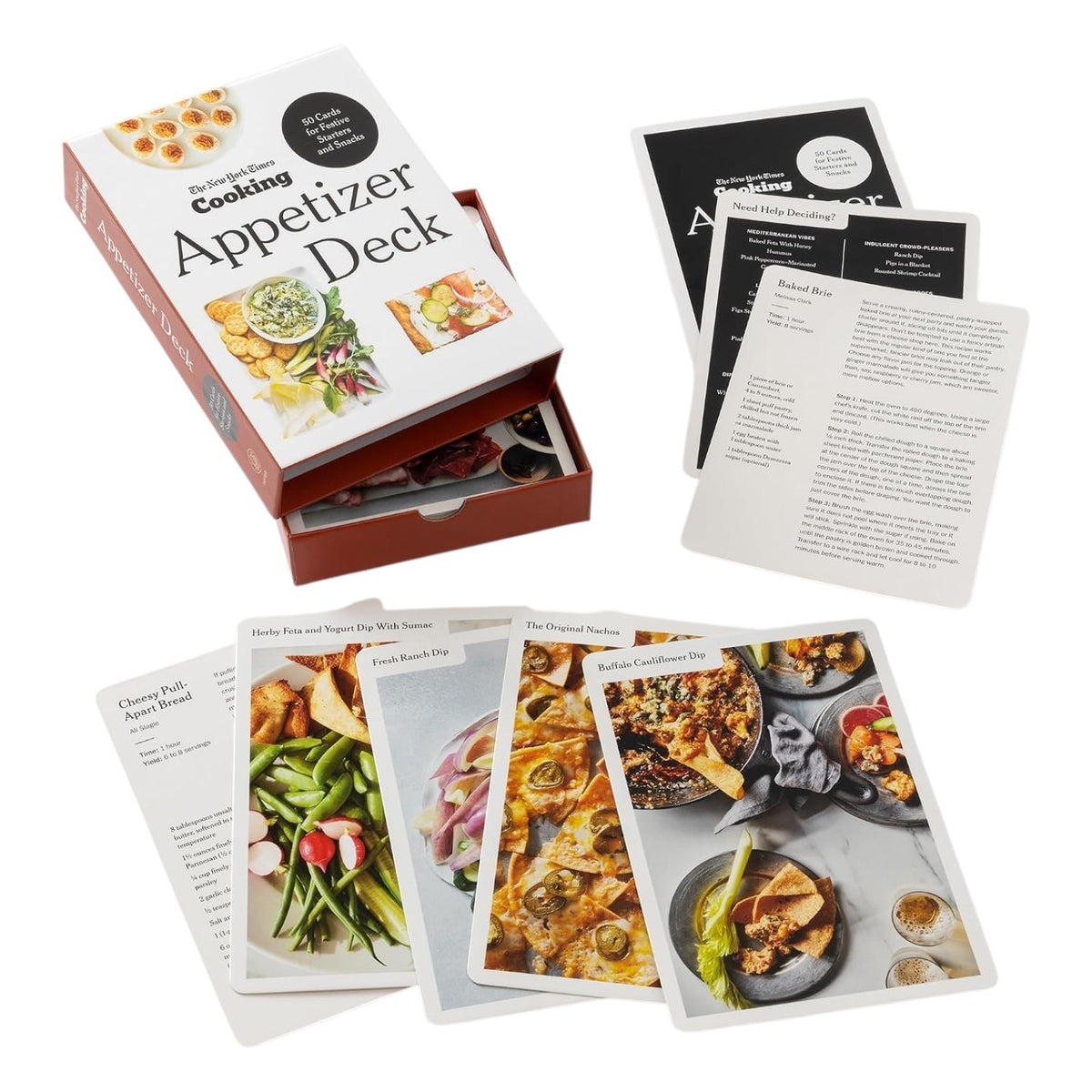 An open box labeled “The New York Times Cooking Appetizer Deck” by Penguin Random House displays several illustrated recipe cards, each featuring vibrant images of party appetizers and detailed cooking instructions inspired by NYT Cooking.