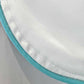 Close-up of a white cotton sateen fabric edge with blue trim and visible stitching, highlighting the luxury sleep quality of the Haute Home Smart Pajama Pant Set.