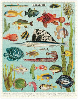 The Aquarium 1,000 Piece Puzzle by Cavallini Papers and Co features colorful aquarium fish and aquatic plants on a light blue background—each species is numbered, making it ideal as a reference or for puzzle enthusiasts.