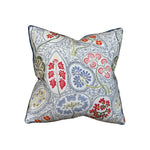 The Arboretum Pillow by Hive Custom Pillows is a square, handmade 100% down-filled pillow with a white background and vibrant floral and leaf patterns in red, blue, green, and pink for luxurious comfort.