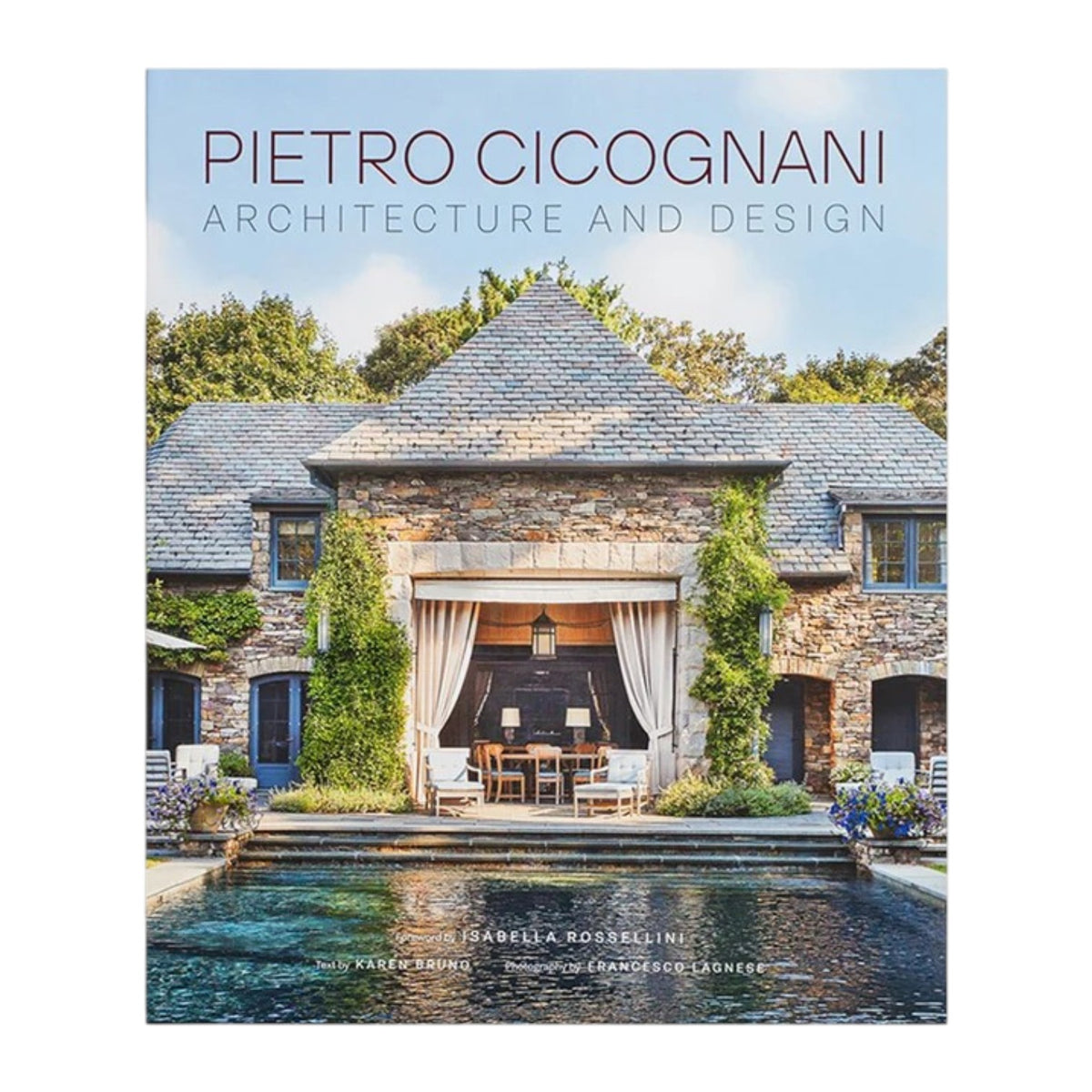 The cover of Common Ground’s “Pietro Cicognani: Architecture and Design” features a stone country house with a pool in front, trees in the background, and outdoor furniture arranged under an archway.