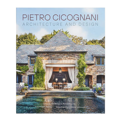 The cover of Common Ground’s “Pietro Cicognani: Architecture and Design” features a stone country house with a pool in front, trees in the background, and outdoor furniture arranged under an archway.
