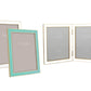 Four Addison Ross Gold Trim Enamel Frame Collection picture frames are displayed: two single frames—one with a teal border—and one elegant double frame, all featuring blank placeholders inside.