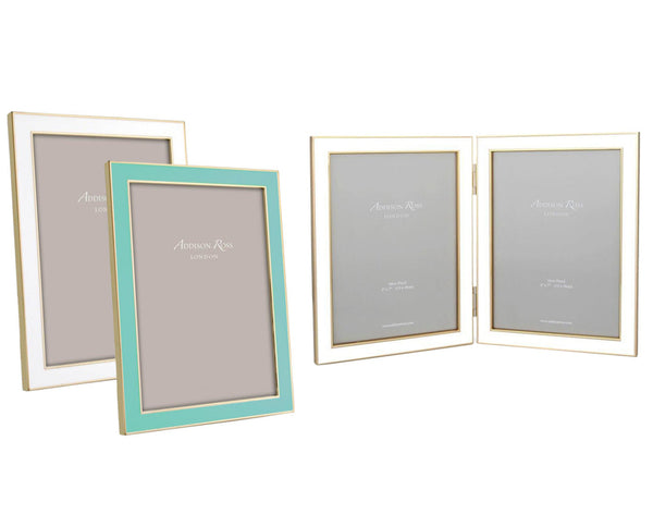 The Addison Ross Gold Trim Enamel Frame Collection includes a turquoise-bordered frame with gold edges, a single gold-edged frame, and a double gold-edged frame for two photos, all featuring fine craftsmanship and luxurious velvet backing.