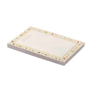 Holiday Argyle Notepad with a gold argyle border patterned with small holiday icons and the text “’Tis The Season.”