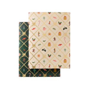 Two Holiday Argyle Pocket Notebooks: one dark green with a gold lattice, and one cream with a gold lattice and assorted holiday icons.