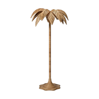 The Solana Floor Lamp by Made Goods features a woven rattan base and a shade inspired by palm tree leaves, shown isolated on a white background.
