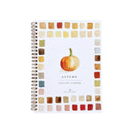 The Emily Lex Studio Watercolor Workbook is a spiral-bound notebook adorned with a watercolor pumpkin and a border of colored squares on the cover, making it an ideal choice for your next painting or art project.