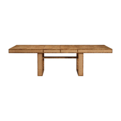 The Dariel Extension Dining Table by Made Goods features a rectangular wooden top with two wide pedestal legs, a horizontal support beam, and natural burl patterns for added texture.