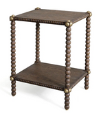 A Julian Chichester Bobbin Side Table, featuring a square rustic oak design with two tiers, bobbin legs, and aged brass hardware at each corner.