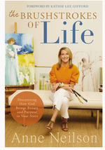 Book cover of "Anne Neilson: The Brushstrokes of Life" by Thomas Nelson/Harper Collins, showing Anne Neilson with paintbrushes and paintings in the background, capturing her faith-inspired art journey.