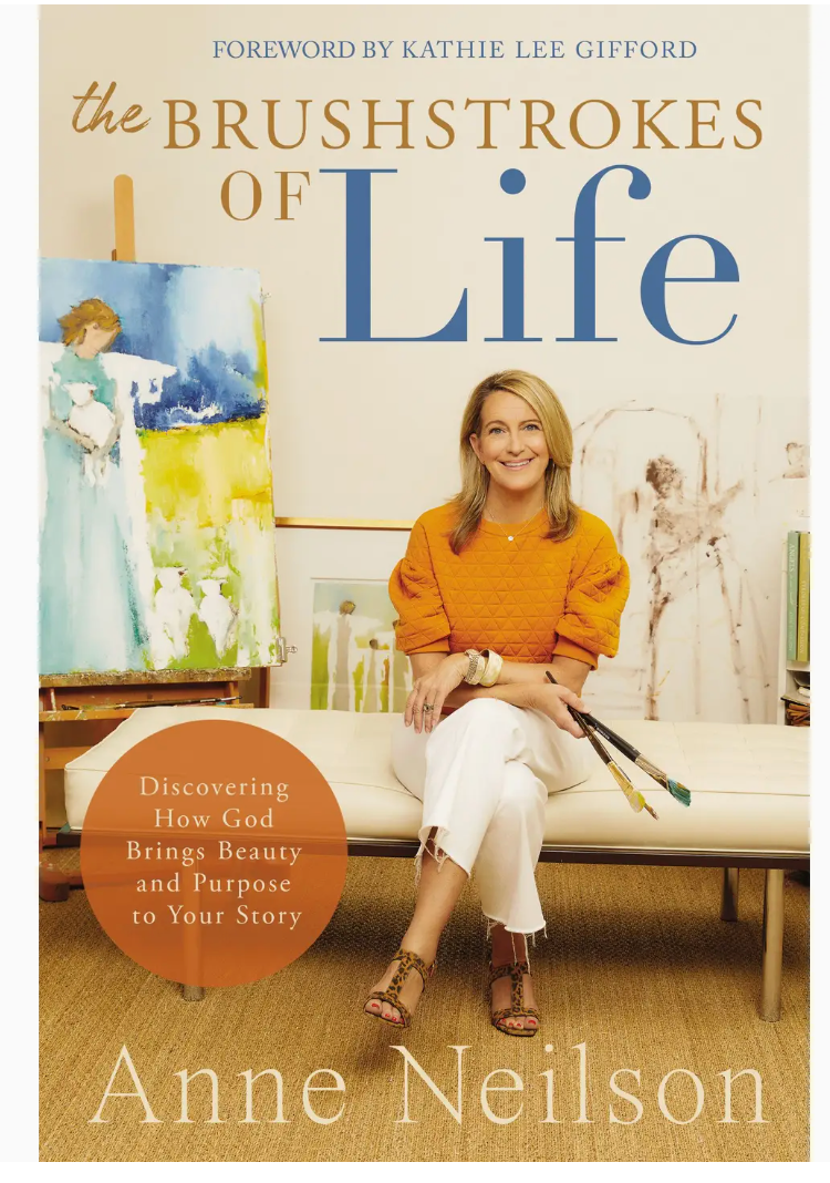 Book cover of "Anne Neilson: The Brushstrokes of Life" by Thomas Nelson/Harper Collins, showing Anne Neilson with paintbrushes and paintings in the background, capturing her faith-inspired art journey.