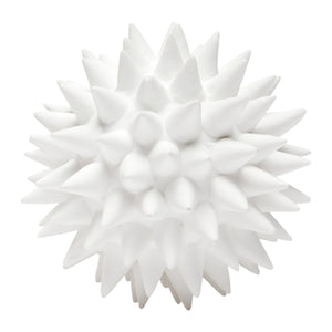 The Irma White Porcelain Puffer Ball, Large by Made Goods is a spiky, spherical decor piece with pointed protrusions, resembling intricate puffer balls when viewed from above against a white background.