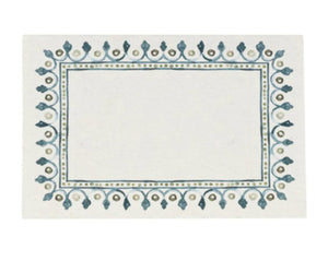 The Juliska Villa Seville Chambray Place Cards feature a decorative blue and green border inspired by Seville motifs, adding charm and elegance to your table setting.