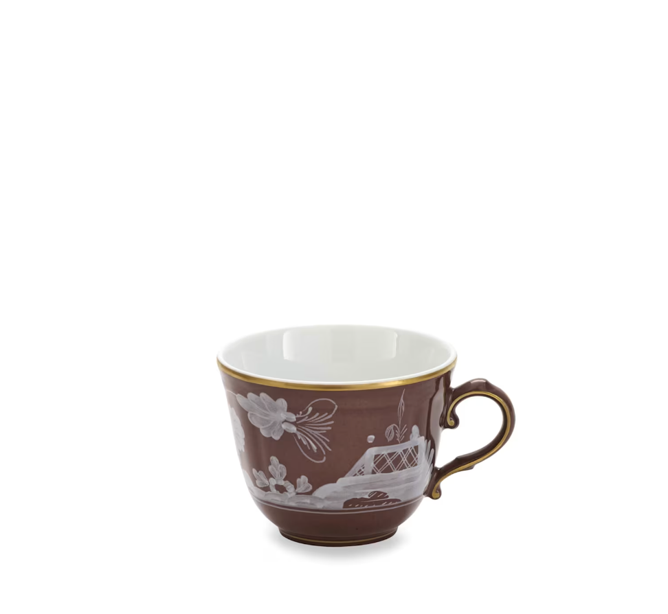 Ginori 1735 Oriente Italiano Castagna Decor Collection porcelain teacup with a brown exterior featuring a white floral and landscape design on one side, a white interior, gold rim and handle. Expertly crafted in the tradition of Italian manufacturing, this cup is photographed centered on a white background.