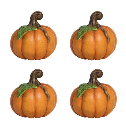 Four identical orange pumpkins with green leaves and brown stems, arranged in a 2x2 grid—perfect as festive decor or place card holders for your autumn table setting. Forest Walk Tabletop Collection by Juliska.