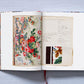 The Book of Printed Fabrics by Taschen reveals a vibrant floral textile design alongside handwritten notes and fabric swatches, offering insight into fabric printing history at the Musée de l’Impression sur Étoffes.