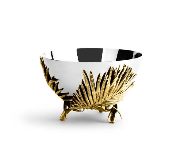 The Michael Aram Palm Medium Bowl by Michael Aram features reflective silver, sculpted textures, gold palm leaf accents, and tripod feet, shown against a plain white background.