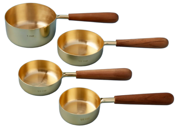 Four Be Home Gold & Wood Measuring Cups, Set of 4, each featuring a unique finish and labeled 1 cup, 1/2 cup, 1/3 cup, and 1/4 cup, displayed