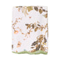 The Vivian Magnolia Floral Scallop Bath Towel by Weezie Towels features a botanical and butterfly print with green trim, crafted from quick-dry terry for comfort and convenience.