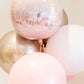 A collection of pink, white, and metallic Signature Balloons by Burton+Burton, featuring an elegant script that reads "Happy Birthday." Ideal for any celebration and available for local delivery along with stunning floral arrangements.