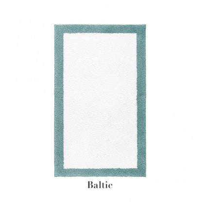 A rectangular white Egoist Border Bath Rug by Graciozza, crafted from soft Egyptian cotton with a customizable teal border, labeled "Baltic" below the image.