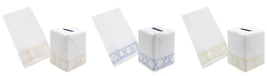 Four white Italian linen tissue box covers and matching hand towels from the Bamboozle Bath Collection by Haute Home—available in tan, blue, and green—each featuring a geometric embroidered border. Displayed on a white background, these pieces are perfect for elevating your home décor with timeless elegance.