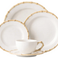 The Classic Bamboo Dinnerware Collection by Juliska features white ceramic pieces with bamboo-patterned rims for casual elegance. Set includes dinner plate, salad plate, bread plate, cup, and saucer.