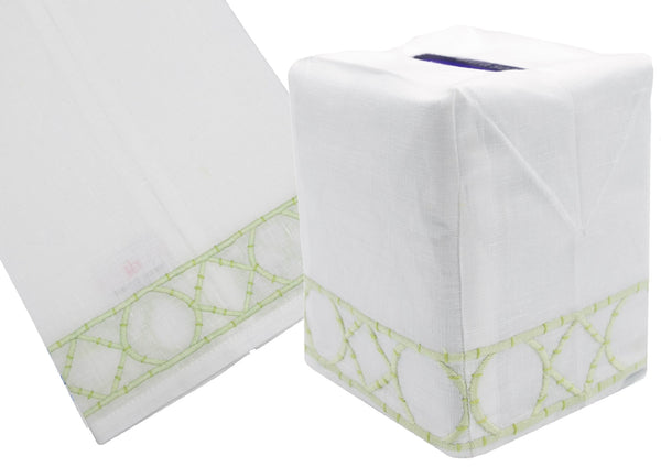 Two images of a Haute Home Bamboozle Collection, Green linen tissue box cover: one image showing a flat, folded design with green decorative stitching, and the other displaying the cover fitted over a tissue box.
