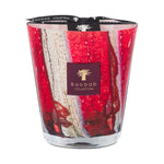 The Baobab Collection Woods Risoud Candle is a large artisan glass candle with a red and white marbled design and a black and gold label on the front.