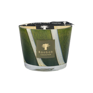 The Baobab Woods Sherwood Candle by Baobab comes in a glass container with a green and white abstract design, a branded front label, and evokes the lush spirit of the English countryside and Sherwood Forest.