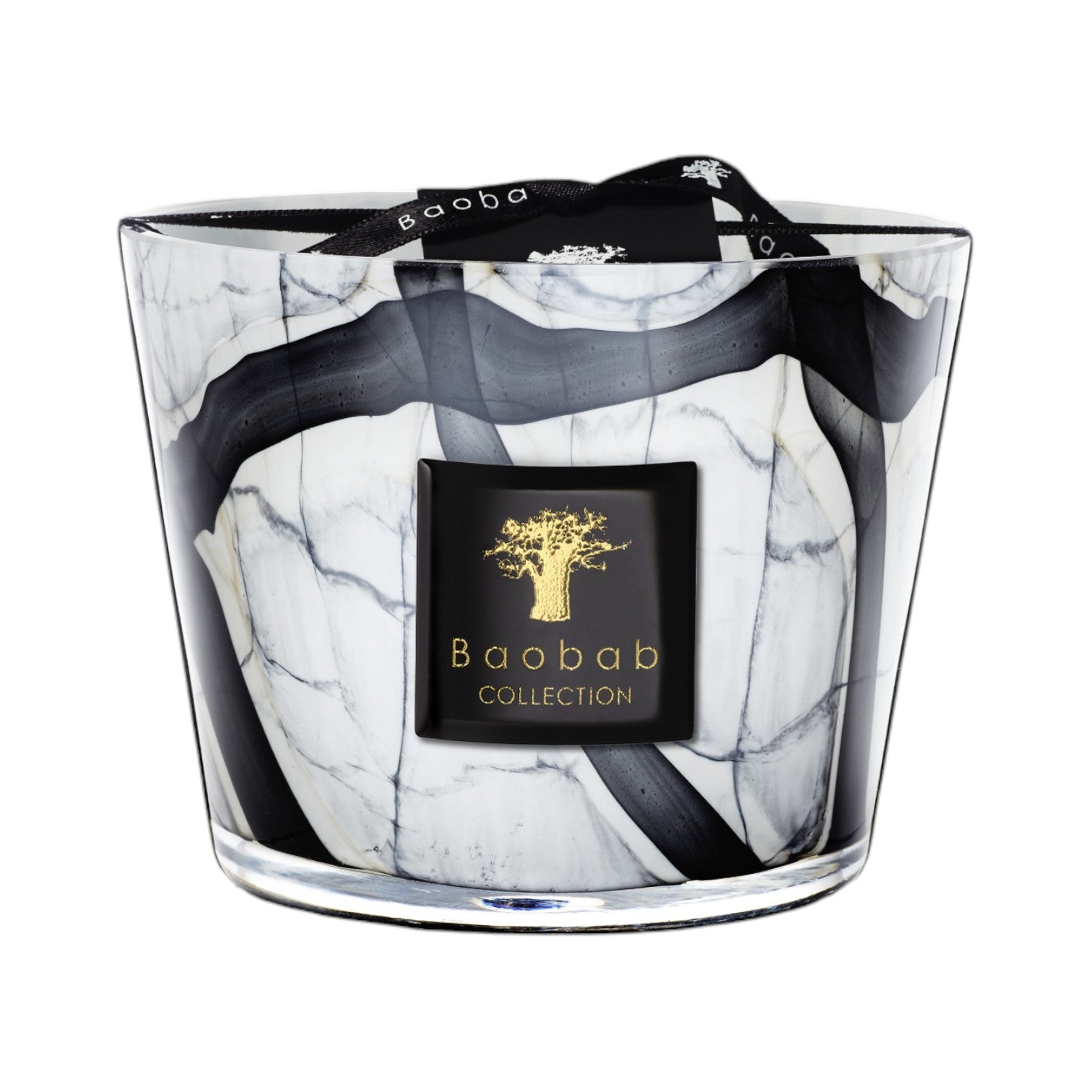 The Baobab Collection Stones Marble Candle by Baobab comes in a hand-blown grey marble-patterned black and white glass holder, with a black and gold label on the front and a black ribbon tied on top.