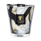 The Baobab Collection Stones Marble Candle by Baobab comes in a hand-blown glass holder with black, white, and beige marbled patterns, finished with a black label featuring a gold tree logo.