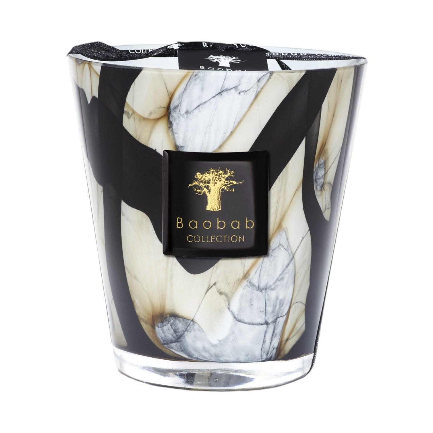 The Baobab Collection Stones Marble Candle by Baobab comes in a hand-blown glass holder with black, white, and beige marbled patterns, finished with a black label featuring a gold tree logo.