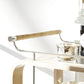 The Brays Bar Cart by Arteriors features a leather-wrapped handle, sleek metal frame, glass shelf, and ample space for drinks and snacks—an elegant choice for your next cocktail party.
