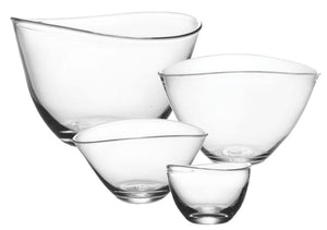 The Simon Pearce Barre Bowl Collection features four clear glass bowls of varying sizes, nested together and distinguished by a modern design with an asymmetrical wave rim.