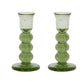 The Provence Candlestick Set by Juliska features green mouth-blown glass with a rounded, stacked design—perfect for adding bubbly charm to your decor. Shown on a white background.