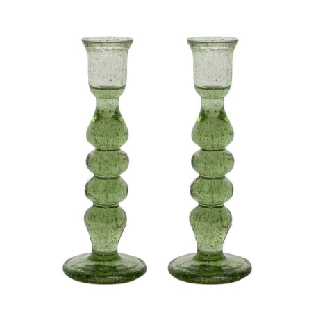 The Provence Candlestick Set by Juliska features a pair of green, mouth-blown glass candlesticks with a textured, bubble-like design and round bases, displayed on a white background.