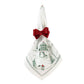 Juliska Evergreen Country Estate Winter Frolic Napkin secured with a red ribbon bow, featuring a green winter scene with snowmen and a gazebo.