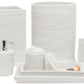 The Dalton Bath Collection by Pigeon & Poodle features white woven rattan bathroom accessories—trash bin, tissue box, soap dispenser, tray, cup, and storage containers—handmade with detailed craftsmanship for an elegant look.