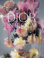 A bouquet of roses and lilies with melting, surreal textures evokes refined elegance. Large white text reading “DIOR IN BLOOM” spans the flowers, complementing the dreamy rose portraits. The Rizzoli logo appears at the bottom.