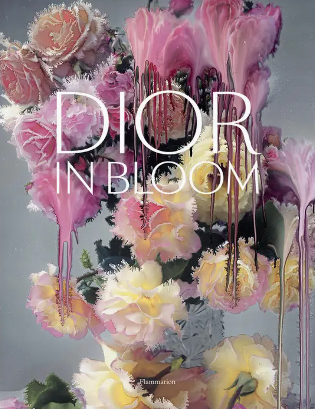 A bouquet of roses and lilies with melting, surreal textures evokes refined elegance. Large white text reading “DIOR IN BLOOM” spans the flowers, complementing the dreamy rose portraits. The Rizzoli logo appears at the bottom.
