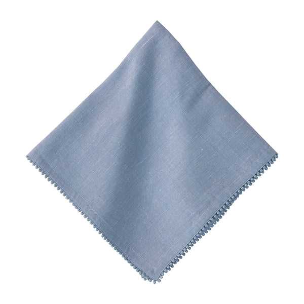 The Berry Trim Napkin Collection by Juliska features light blue linen napkins with decorative embroidered trim, shown against a white background.