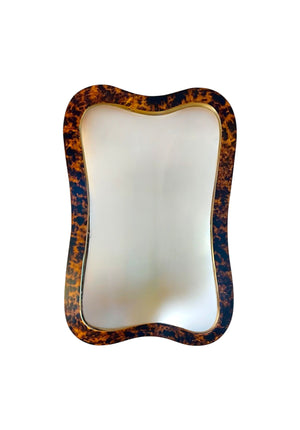 The Alegro Mirror in Tortoise by Carvers' Guild features a rectangular shape with a wavy tortoise shell-patterned frame and elegant gold edge, displayed against a white background.