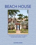 Cover of Beach House, showing a Mediterranean-style home with palm trees and an arched entryway overlooking the ocean.