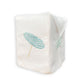 The Beach Umbrella Bath Collection tissue box cover by Haute Home features an embroidered light blue umbrella design on premium Italian linen, adding an elegant touch to your space.