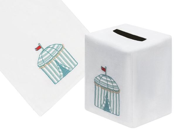 Exquisite aqua linen tissue box cover and hand towel set from Haute Home's Beach Cabana Bath Collection, featuring a hand-embroidered circus tent design with red flags.