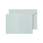 The Crane Beach Glass Embossed Note Card Set features elegant embossed cards on luxurious cotton paper, each paired with a matching envelope—shown against a plain white background.