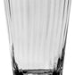 A clear, empty Corinne Collection drinking glass by William Yeoward Crystal, featuring a vertical optic pattern, stands upright against a plain white background.